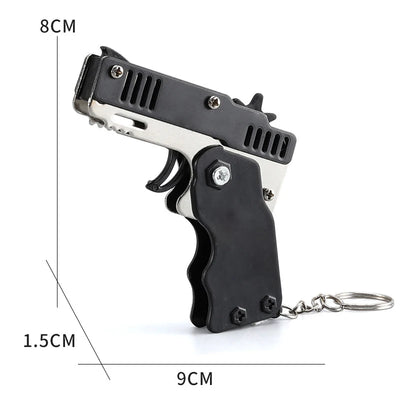 1pcs Mini Metal Gun Folding Rubber Band Toy Outdoor Sports Keychain Toy 6 Bursts Rubber Pistol Kids Gifts Party Favor Gun Toys